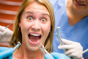 Doctor Giving Dental Treatment to Woman at Clinic – Arlington Heights, IL – Dan Czapek, DMD