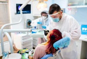 Dentist Examining the Teeth of a Woman – Arlington Heights, IL – Dan Czapek, DMD